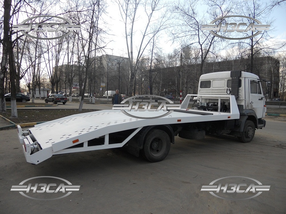 Эвакуатор КАМАЗ-4308 с ломаной платформой